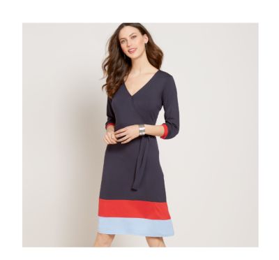 White floral print dress with ruched sleeves & ruffle hem.