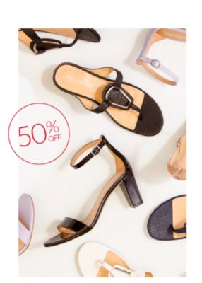 A pair of lavender heeled sandals with ankle strap. 